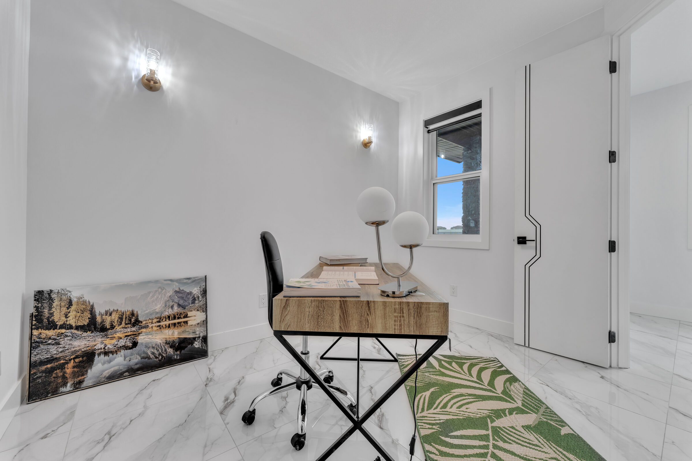 Two-storey great room with marble flooring and gold accents